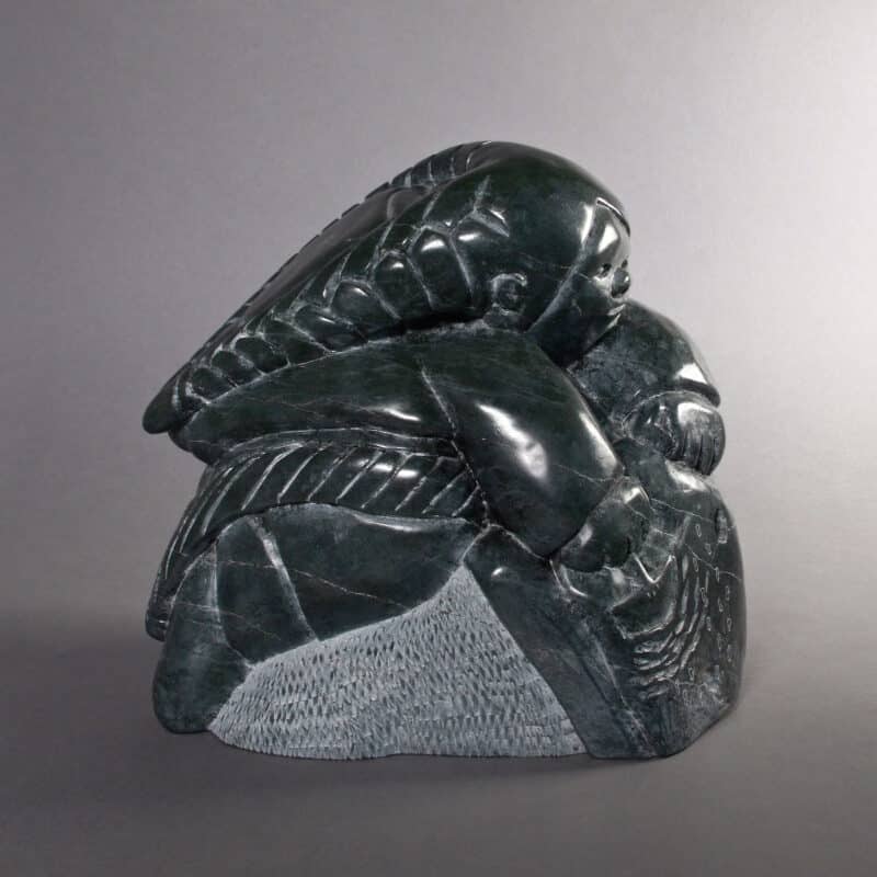 Woman with ulu by Adamie Inukpuk